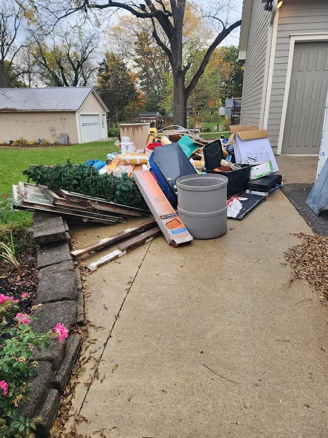 Dumpster being loaded with debris for 30 Yard Dumpster Rental in Mission